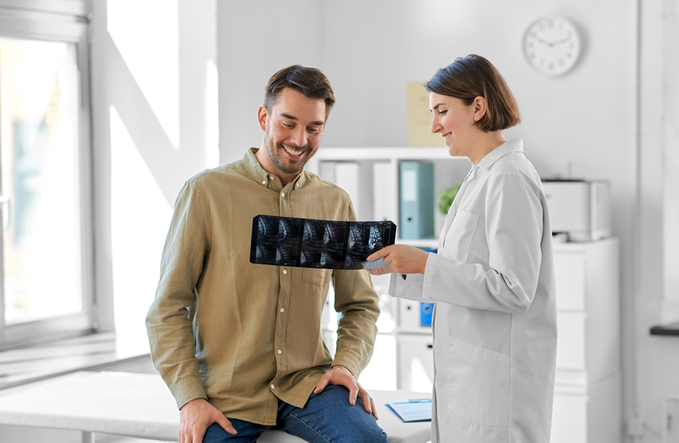 Clinician reviewing X-ray with patient